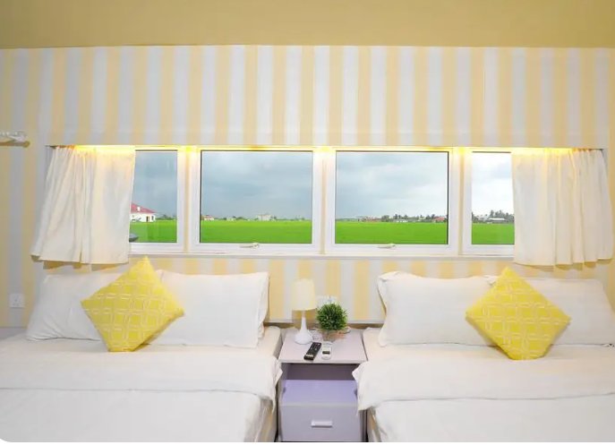 Twin bed bedroom with padi field view